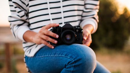 woman holding a camera