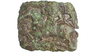 a close-up of a stamp with a warrior riding a horse