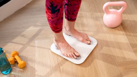 A woman standing on a smart scale