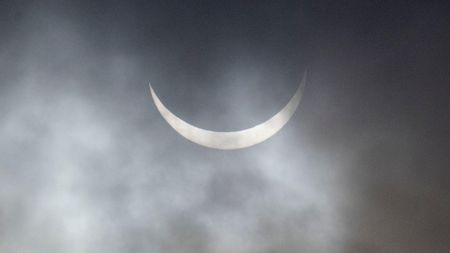 The sun in a very thin crescent shape during a solar eclipse